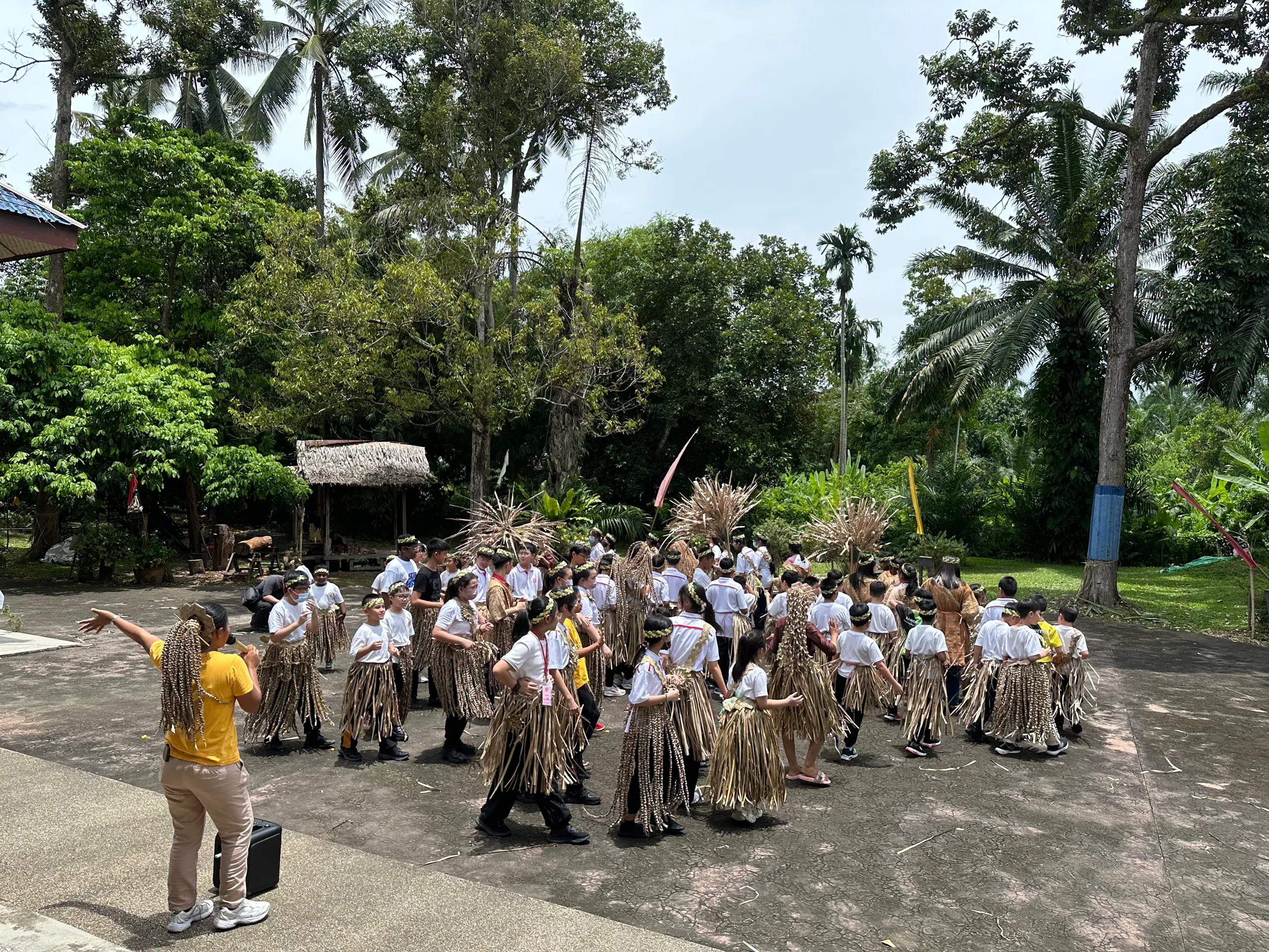 A group of students learning and conducting a Mah Meri Style Wedding in Malaysia.